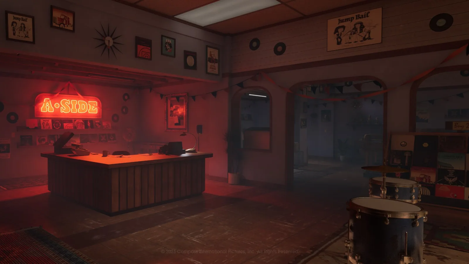 Red-lit record displays and drums inside A-Side Music Store